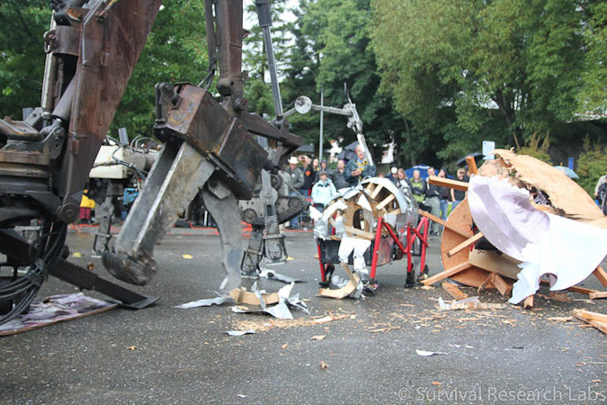 Big Arm vs Stick Wheel Robot