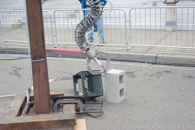 Spine Robot picks up crates